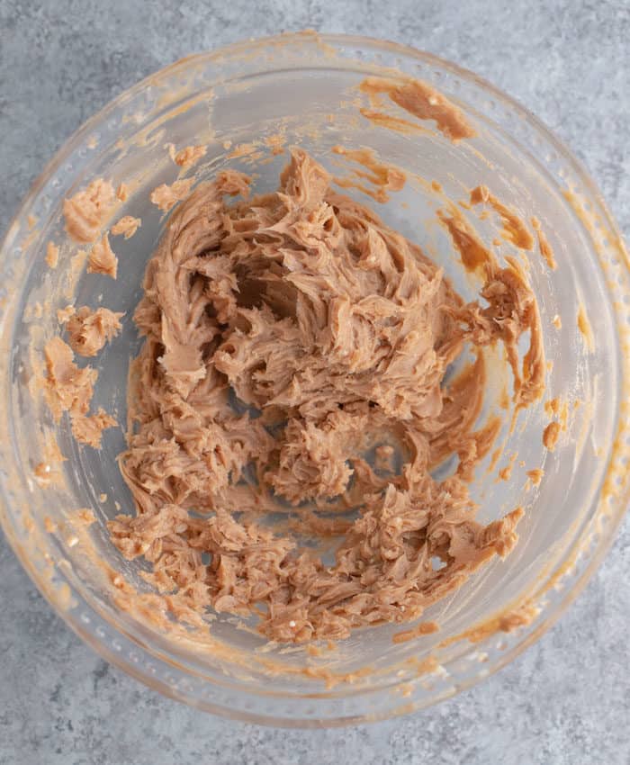 Whipped honey butter in a glass bowl. 