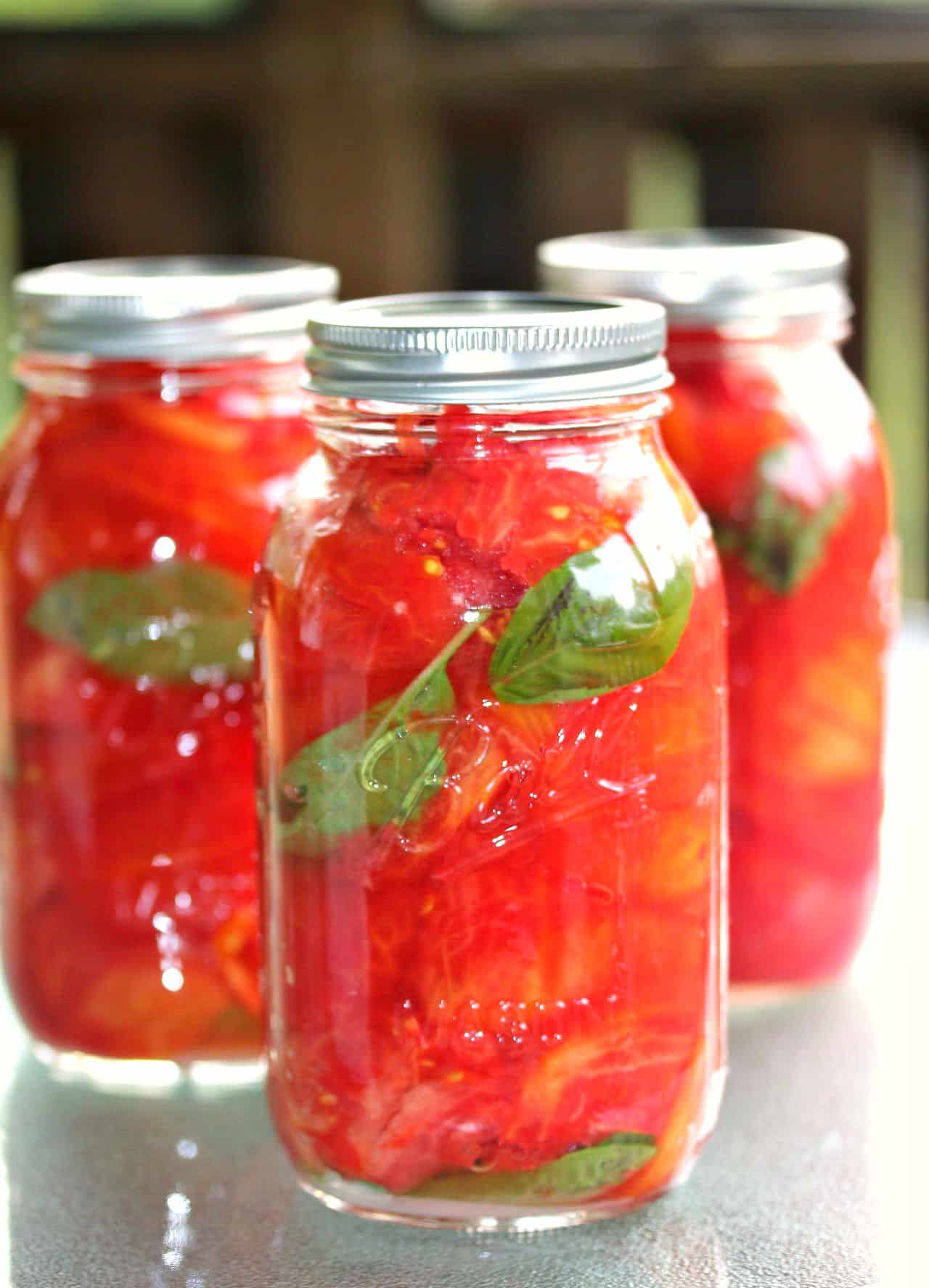 These homemade canned tomatoes are the best way to keep your garden tomatoes fresh and ready to eat and cook with all year long! Canned-Tomatoes