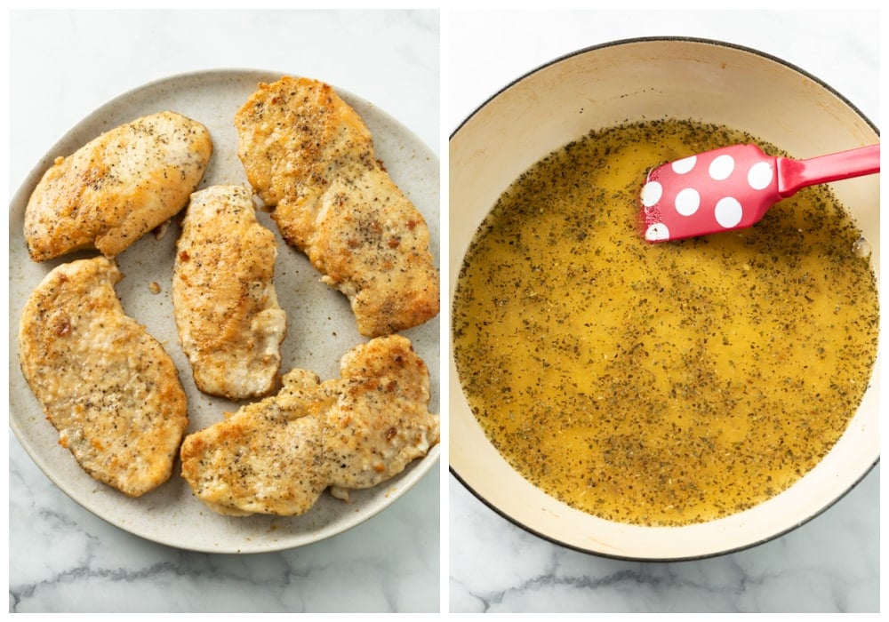 Seared chicken on a plate next to a skillet with chicken broth and herbs.