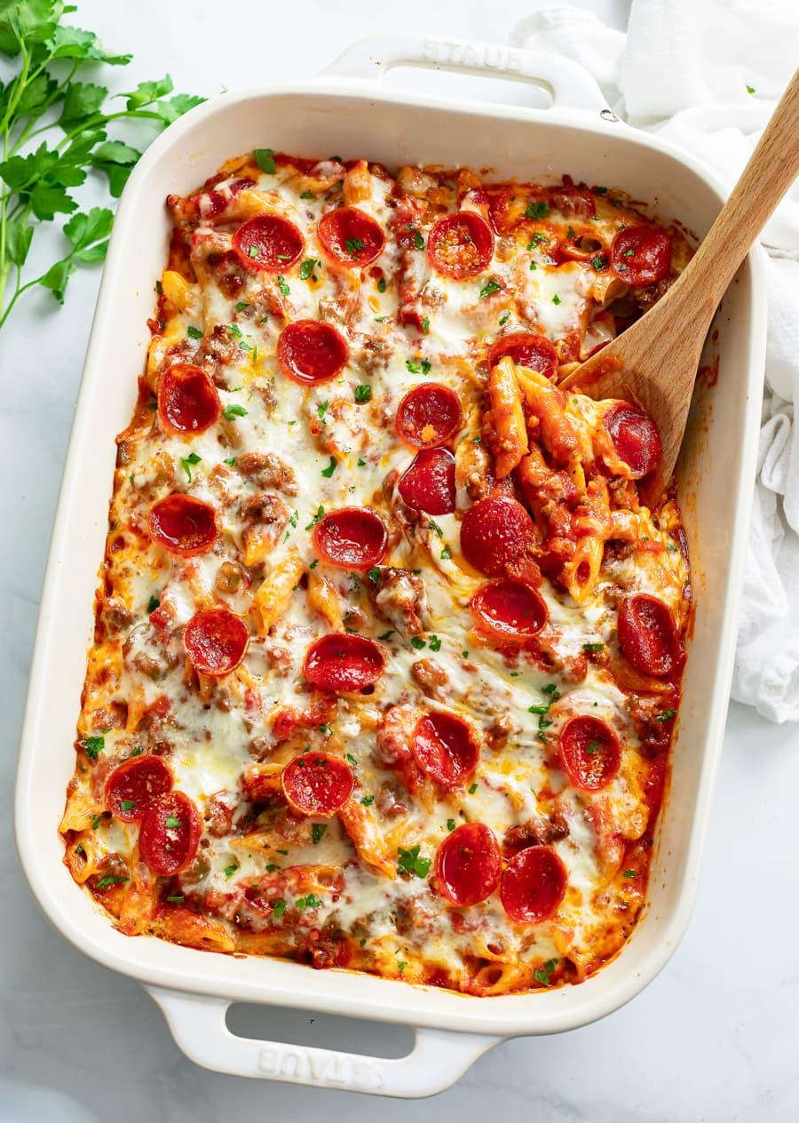 Pizza Pasta in a white casserole dish with pepperoni on top.