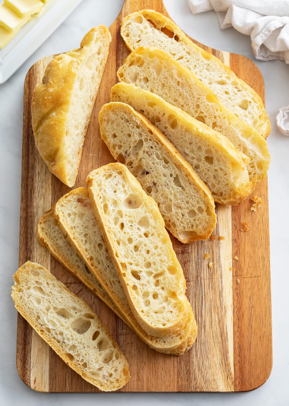 Slices of No Knead Bread on a cutting board.